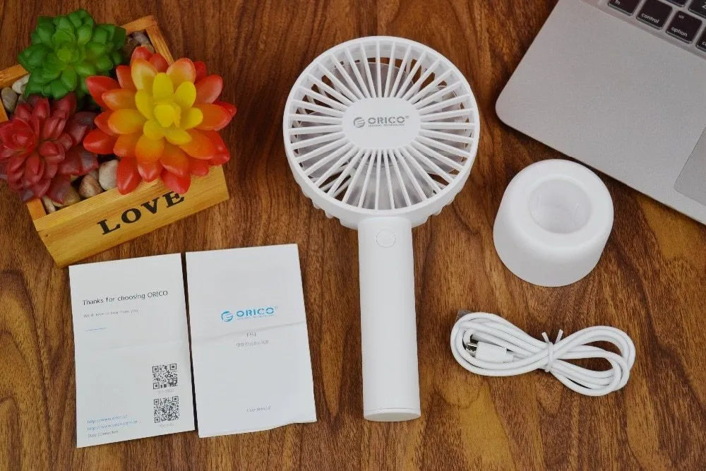 White portable USB desk fan with rechargeable battery, showing three-speed controls and compact design