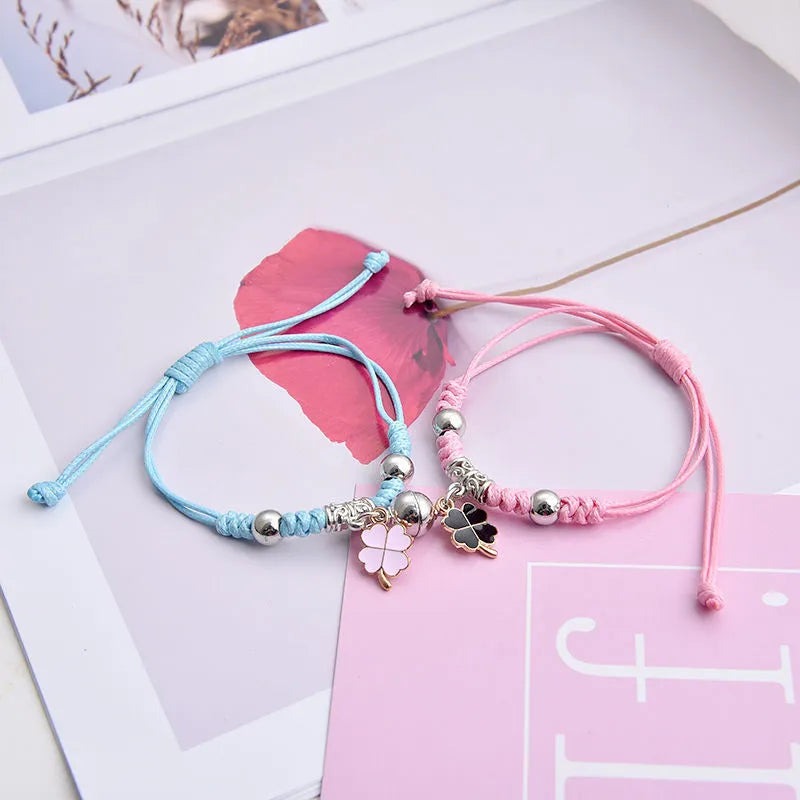 Magnetic couple bracelet pair with alloy electroplating in various designs including clover and crown patterns