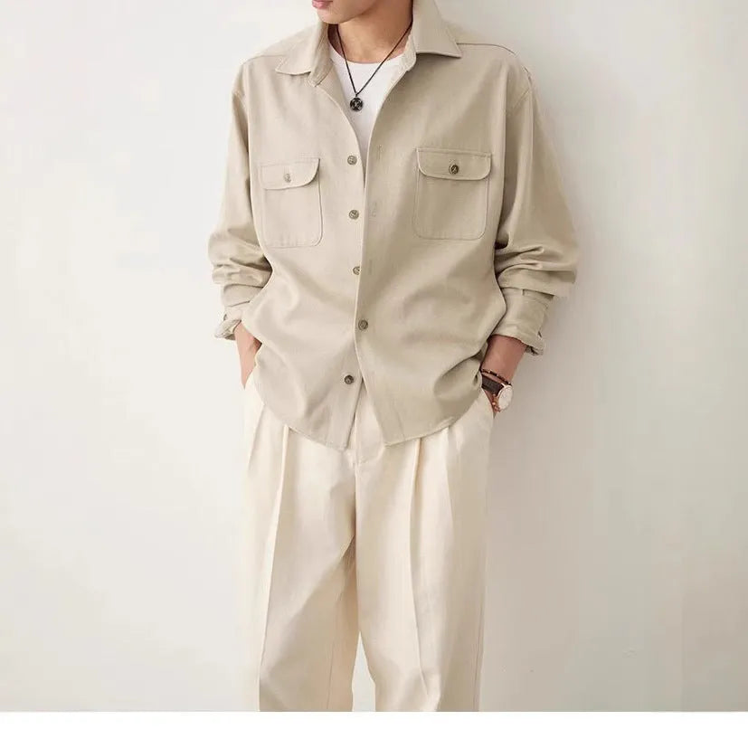 Men's light sand rice casual lapel collar long sleeve shirt on a hanger.