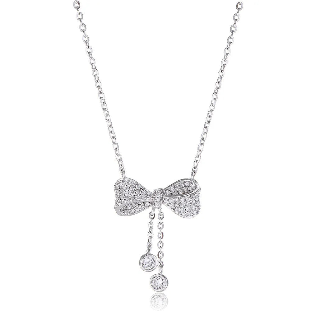 S925 sterling silver bow pendant necklace with O-ring chain on grey background