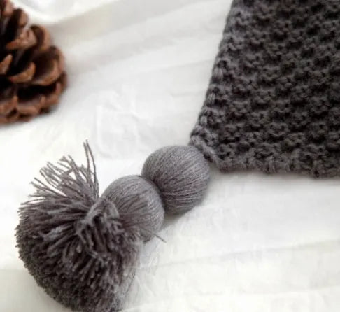 Nordic fringed knit ball blanket in beige colour showing textured design