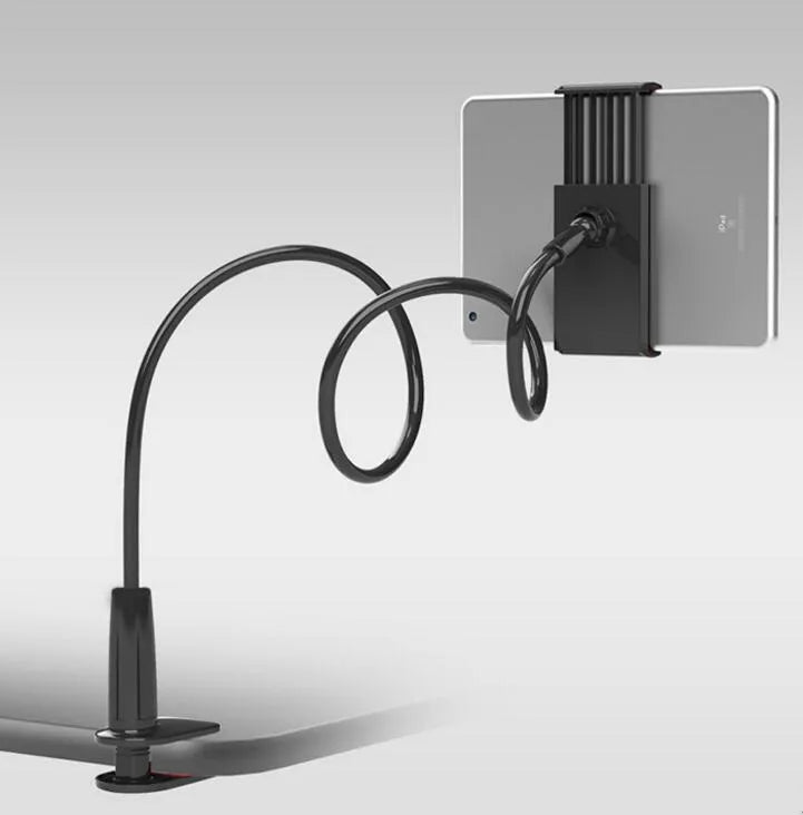 Black bedside oversize flat panel phone holder with a long flexible arm mounted on a table.