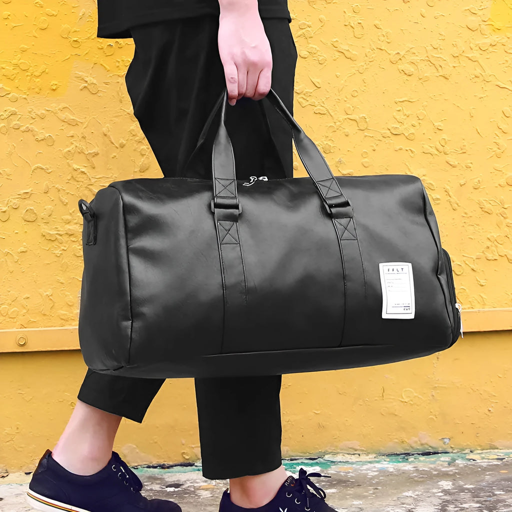 Black waterproof sports bag with diagonal straps and separate side shoe compartments.