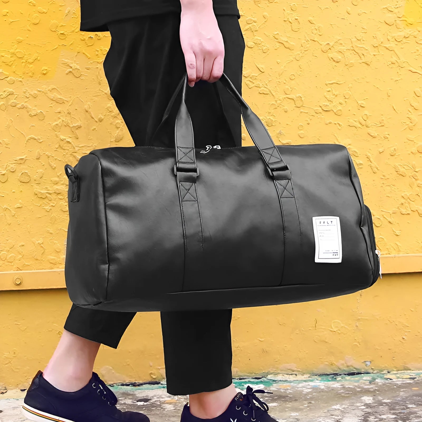 Black waterproof sports bag with diagonal straps and separate side shoe compartments.