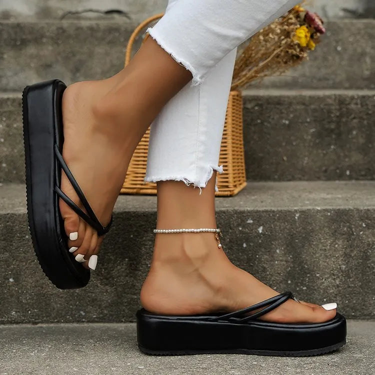 Thick-soled herringbone pattern flip-flops in multiple colours on a white background