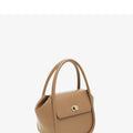 Leather wing bag with latch closure and buckle detailing in cow leather with cross-body strap