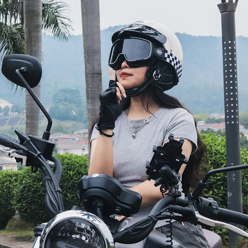 Retro open face motorcycle helmet in matte black, shown from the side on a grey background.