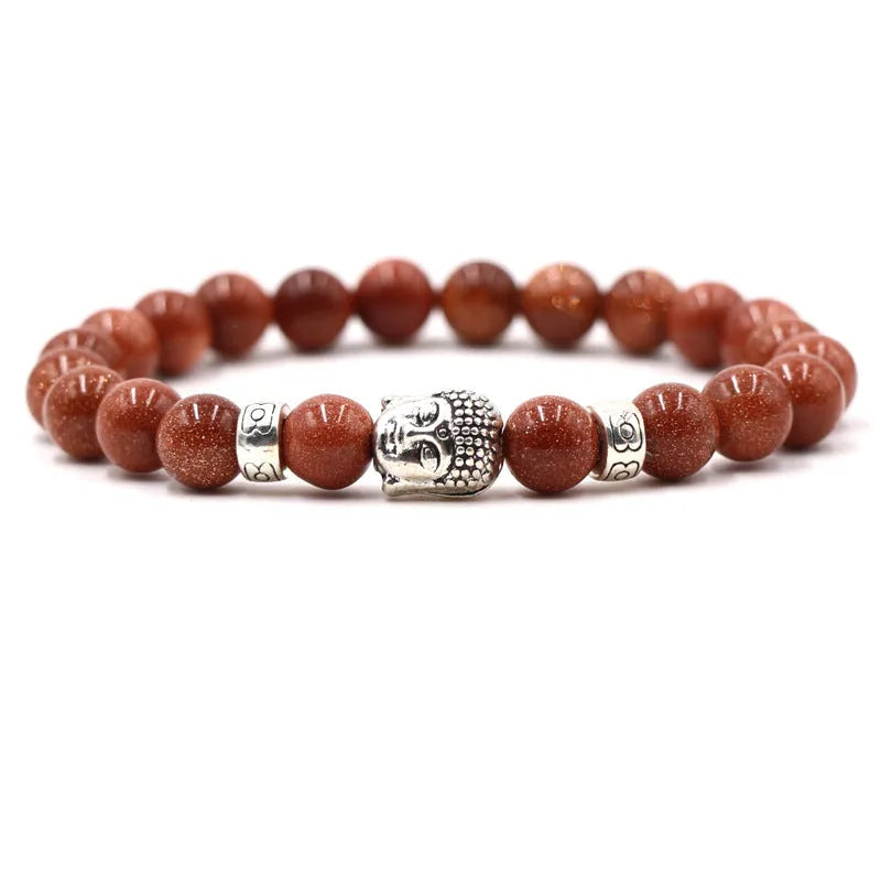 Tigereye stone Buddha head stretch bracelet with 8mm beads on a wrist.