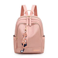 Soft nylon casual backpack in black or pink with three-dimensional pockets and double shoulder straps
