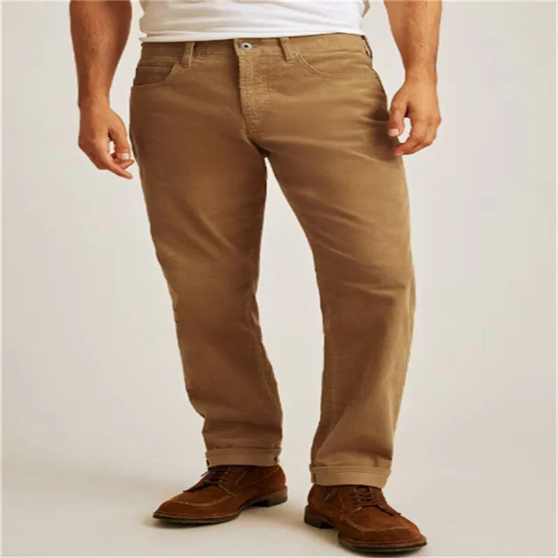 Straight-leg corduroy trousers in a solid colour on a mid-waist model.