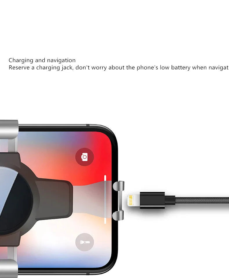 Black ABS gravity mirror car phone holder attached to a vehicle air vent.