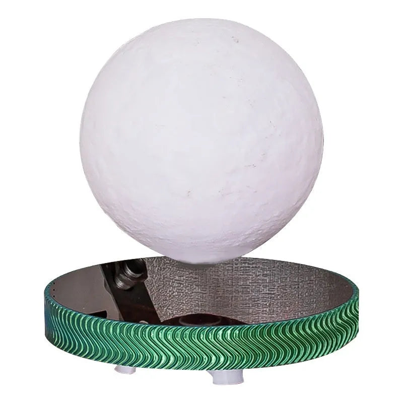 Small white magnetic suspension moon lamp floating above its base as a night light.