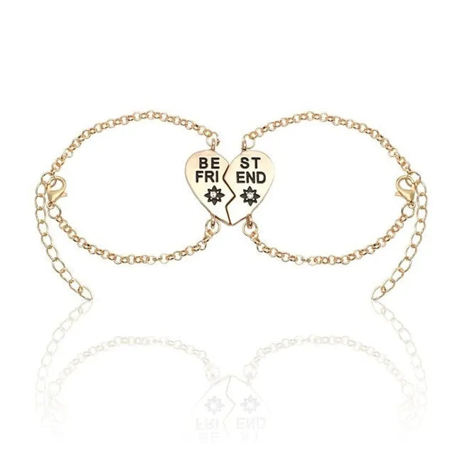 Heart shape alloy bracelet with dripping oil finish and inlaid gems in gold and silver colours