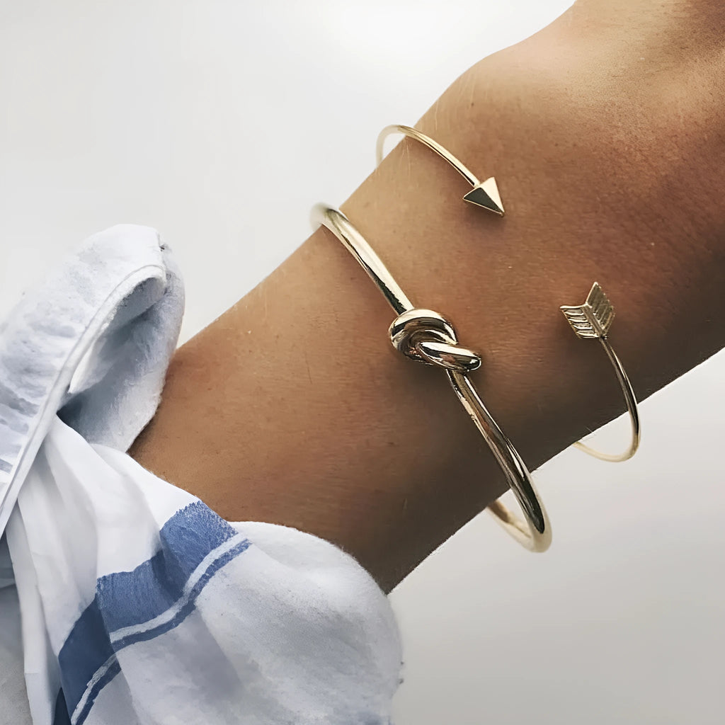Women's vintage gold arrow knotted cuff bracelet made from electroplated alloy.
