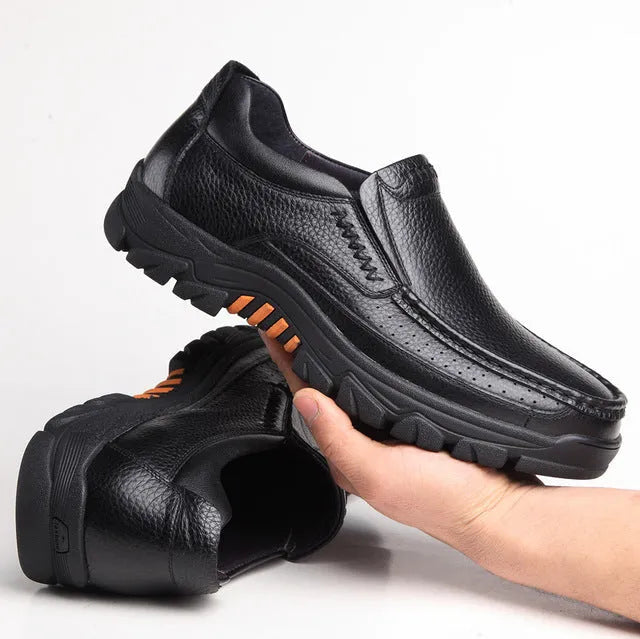 Men's black and brown leather slip-on business casual shoes with a rubber sole.
