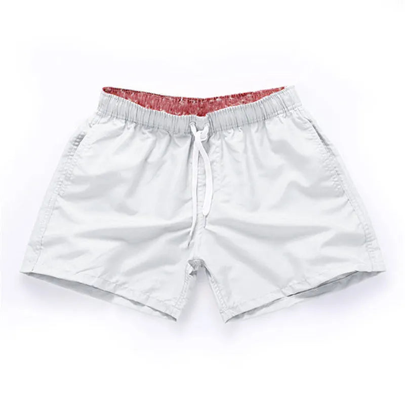 Men's polyester beach shorts in multiple colours with straight leg design for surfing and casual wear