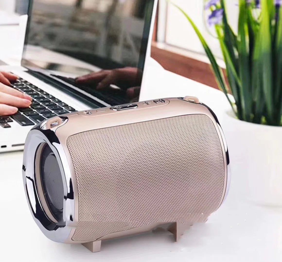 Portable plug-in subwoofer sound system in a metal shell showing button controls and available in five colours.