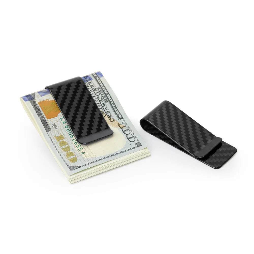 Black genuine carbon fiber money clip with striped glossy surface on a plain background