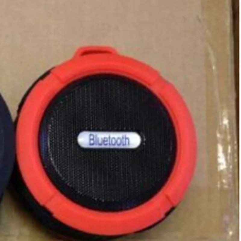 Waterproof portable Bluetooth speaker in multiple colours with mountaineering buckle attachment