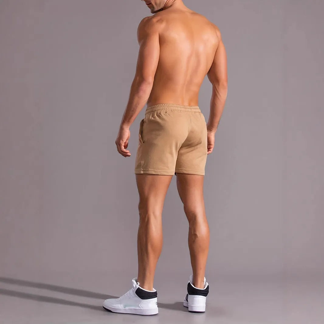 Man wearing khaki coconut print polyester sports shorts