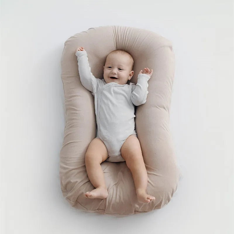 Portable baby nest crib measuring 75x45cm in cotton with PP cotton filler