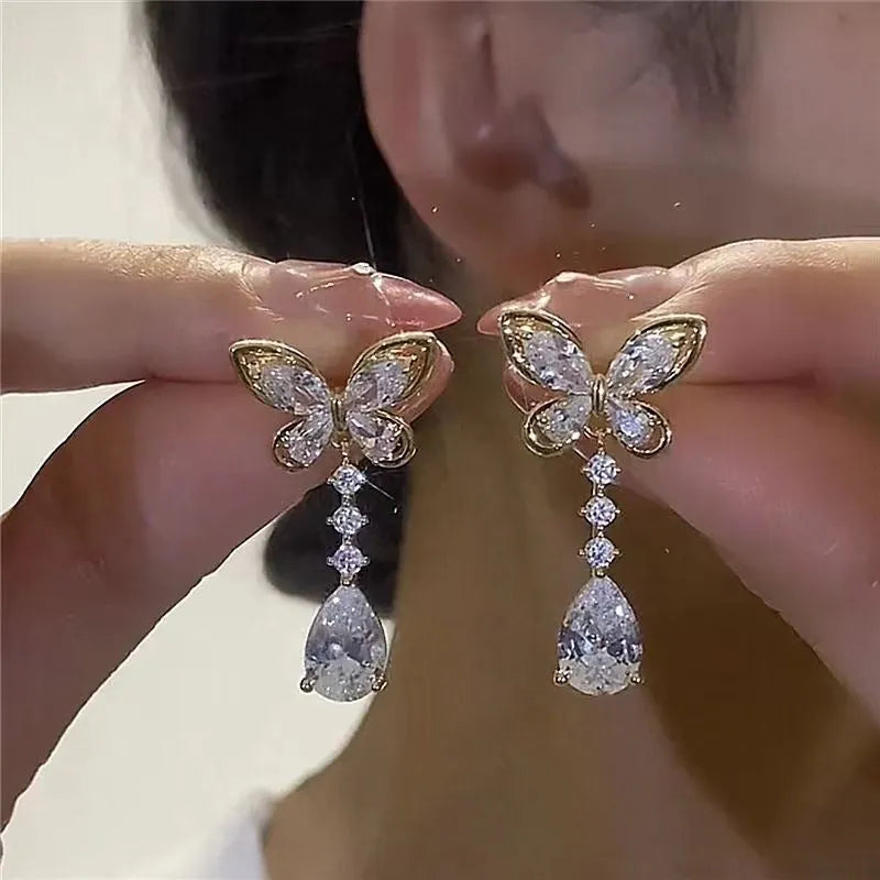 Platinum bow-shaped stud earrings with electroplated finish