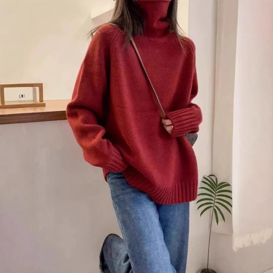 Women's loose red turtleneck sweater with thick curling pile collar, casual style.