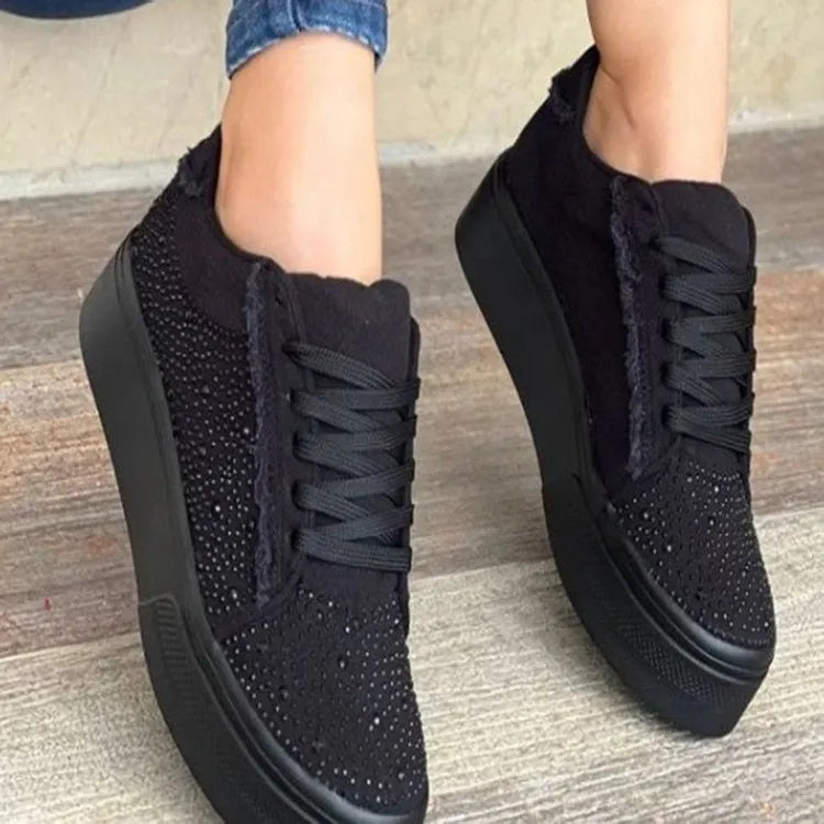 Plus size women's black casual sports shoes with rhinestones on the upper and flat chunky rubber soles.