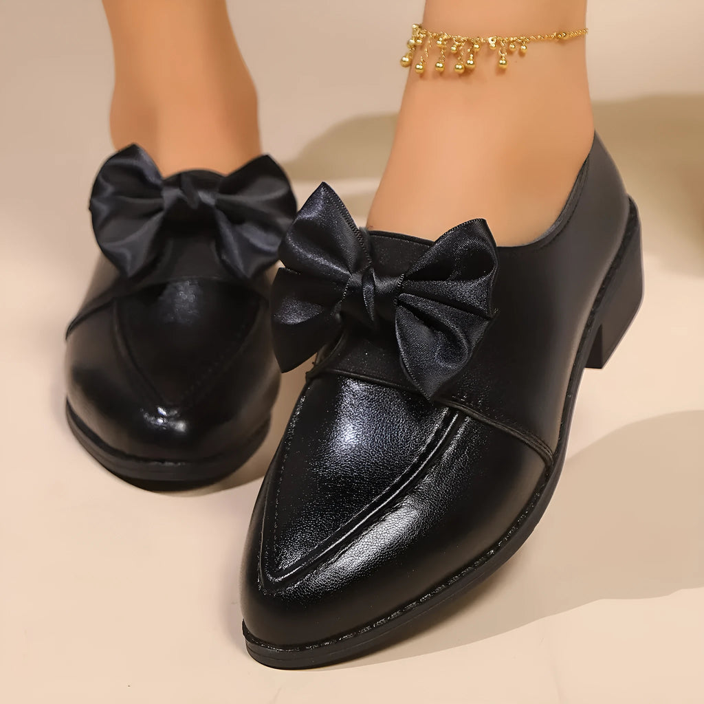 Women's British-style leather shoes with decorative bow detailing on pointed toe