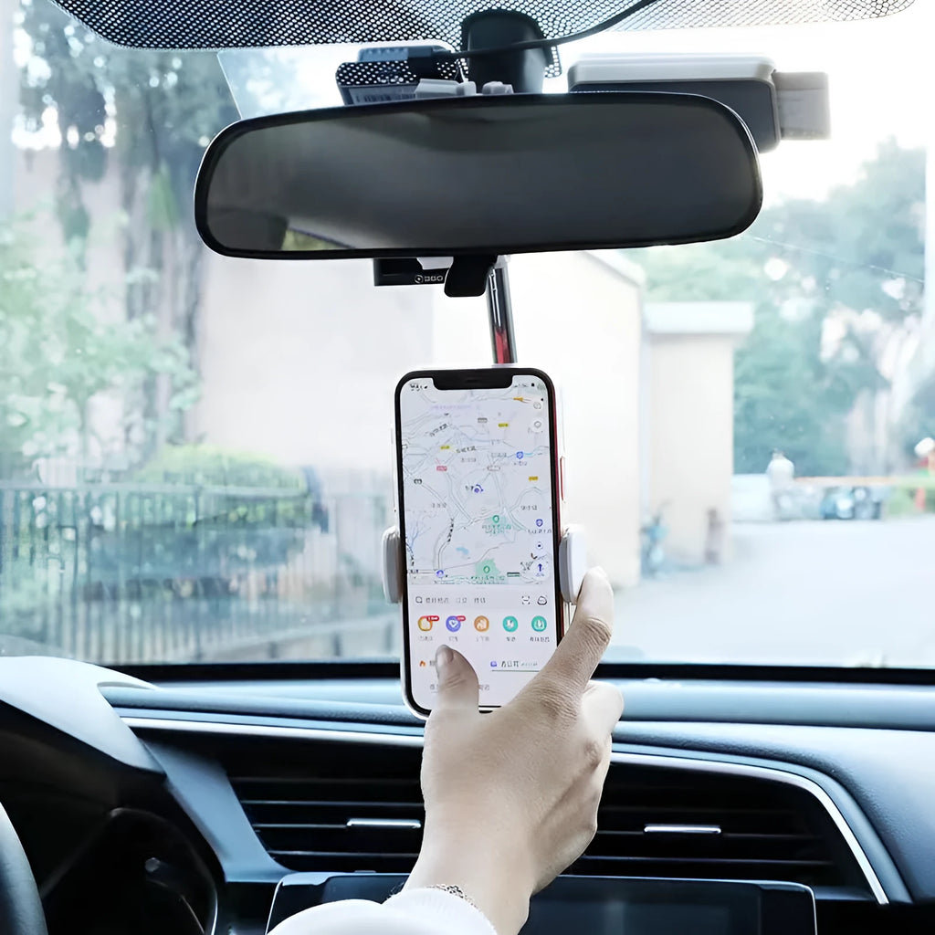 Black ABS plastic mobile phone bracket mounted on vehicle rearview mirror holding smartphone