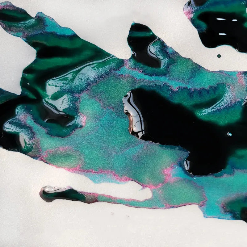 Gradient fountain pen ink bottle with gold powder particles in Red Tide and Truffle colour options