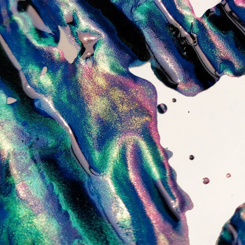Gradient fountain pen ink bottle with gold powder particles in Red Tide and Truffle colour options