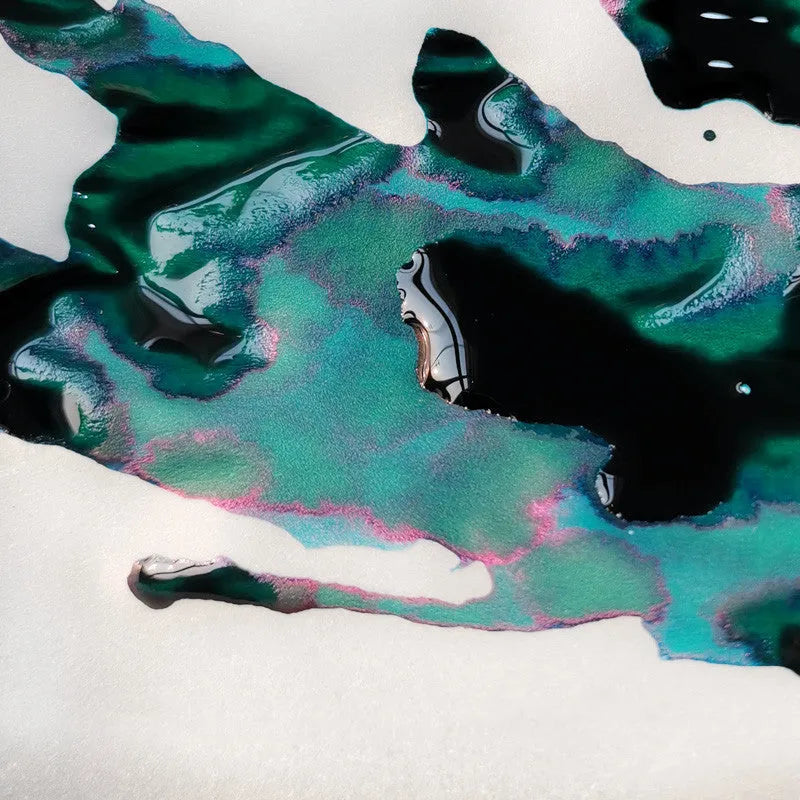 Gradient fountain pen ink bottle with gold powder particles in Red Tide and Truffle colour options