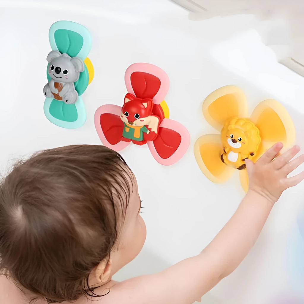 Infant spinning top sucker toy set of 3 pieces in plastic for bath and feeding play
