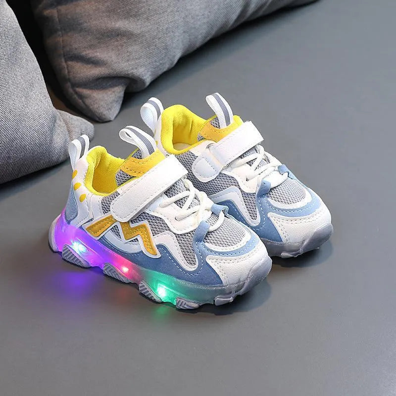 Children's bright light sports sneakers with mesh panels and Velcro strap in black, grey, or pink.