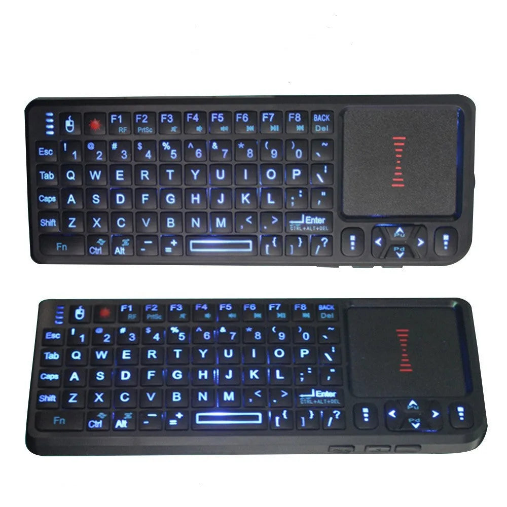 Black wireless mini keyboard with touch screen and optical mouse on a desk.