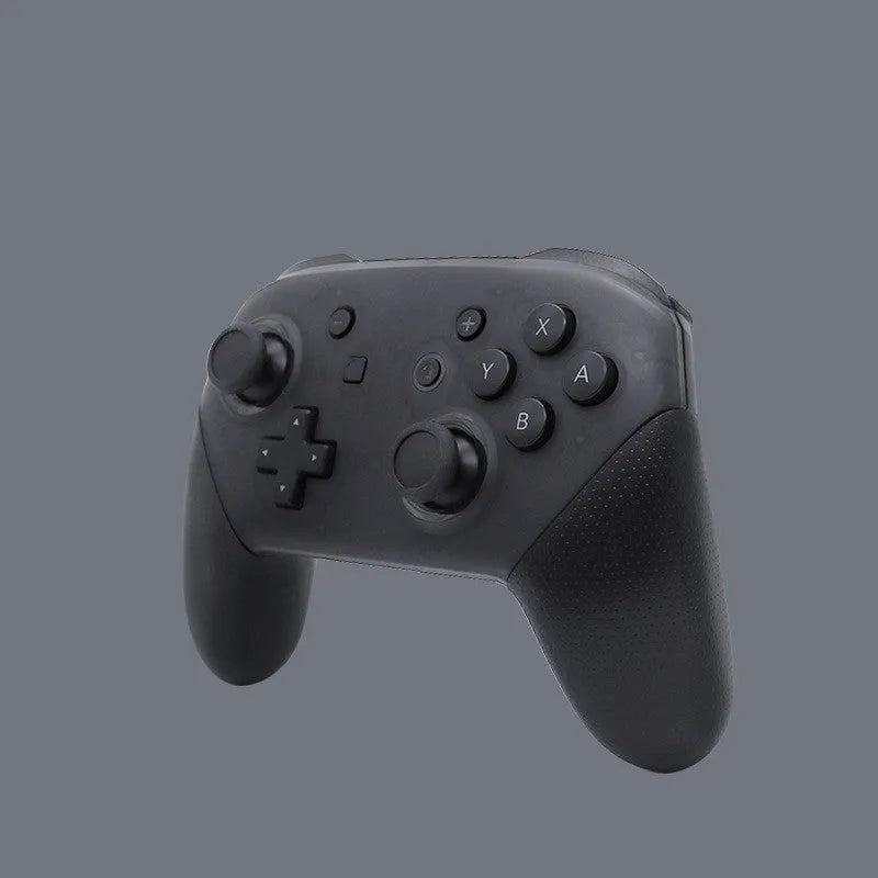 Black Switch PRO wireless Bluetooth gamepad controller for Nintendo Switch on a dark surface.