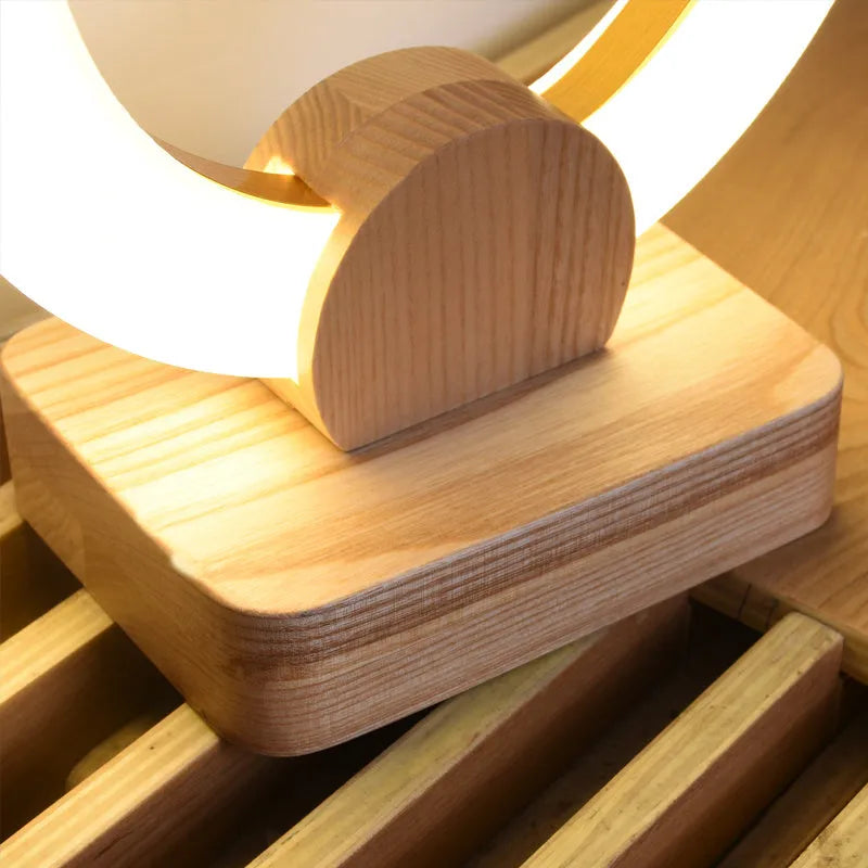 Wooden circular Nordic style LED chandelier with a round acrylic lampshade, shown in two diameter options.