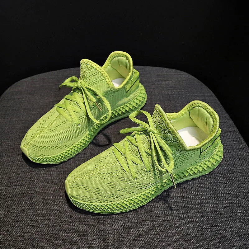 Women's breathable mesh sneakers in yellow with white rubber sole and lace-up fastening