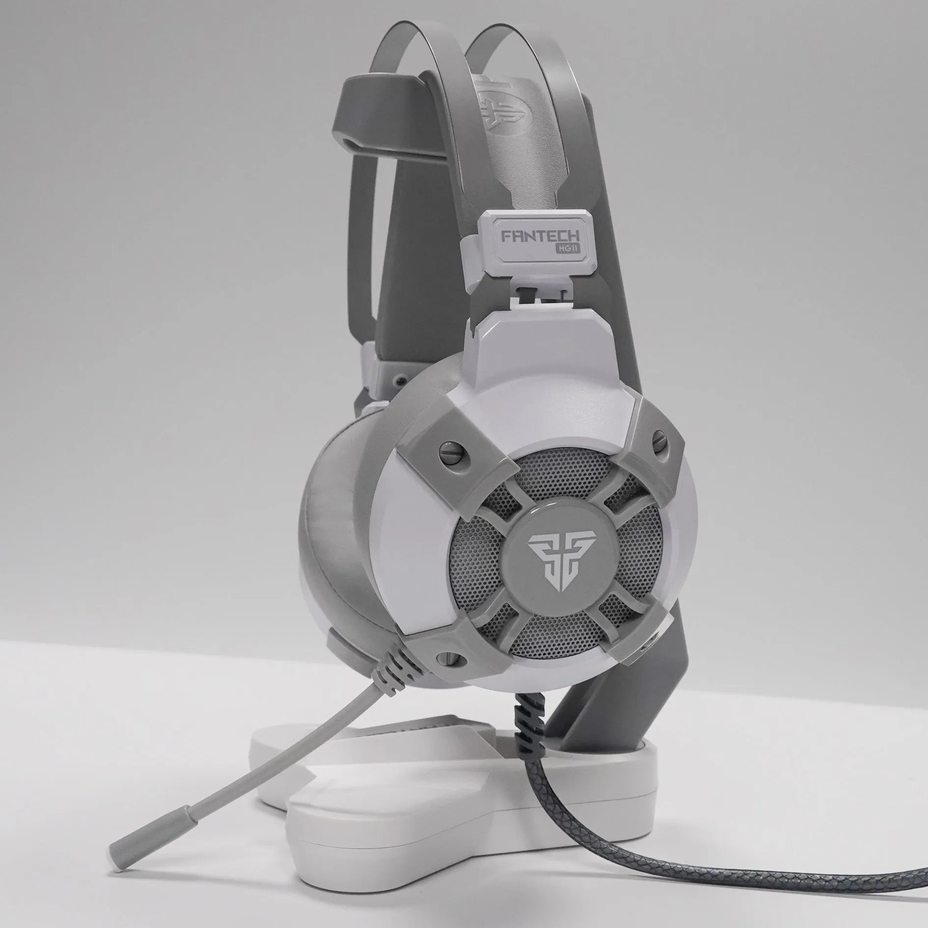 Black FANTECH HG11 gaming headset with RGB lights, large ear cups, and adjustable microphone