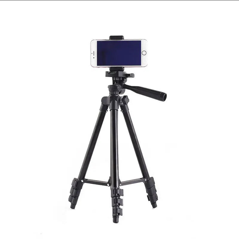 Black aluminium alloy camera tripod with quick release plate extended to shooting height