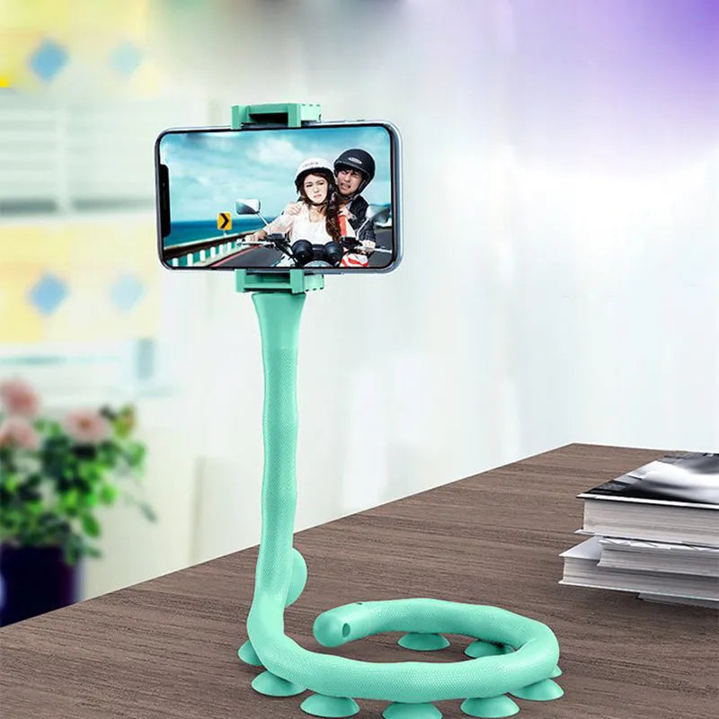 Black flexible worm arm phone holder with suction cup attached to a bicycle handlebar