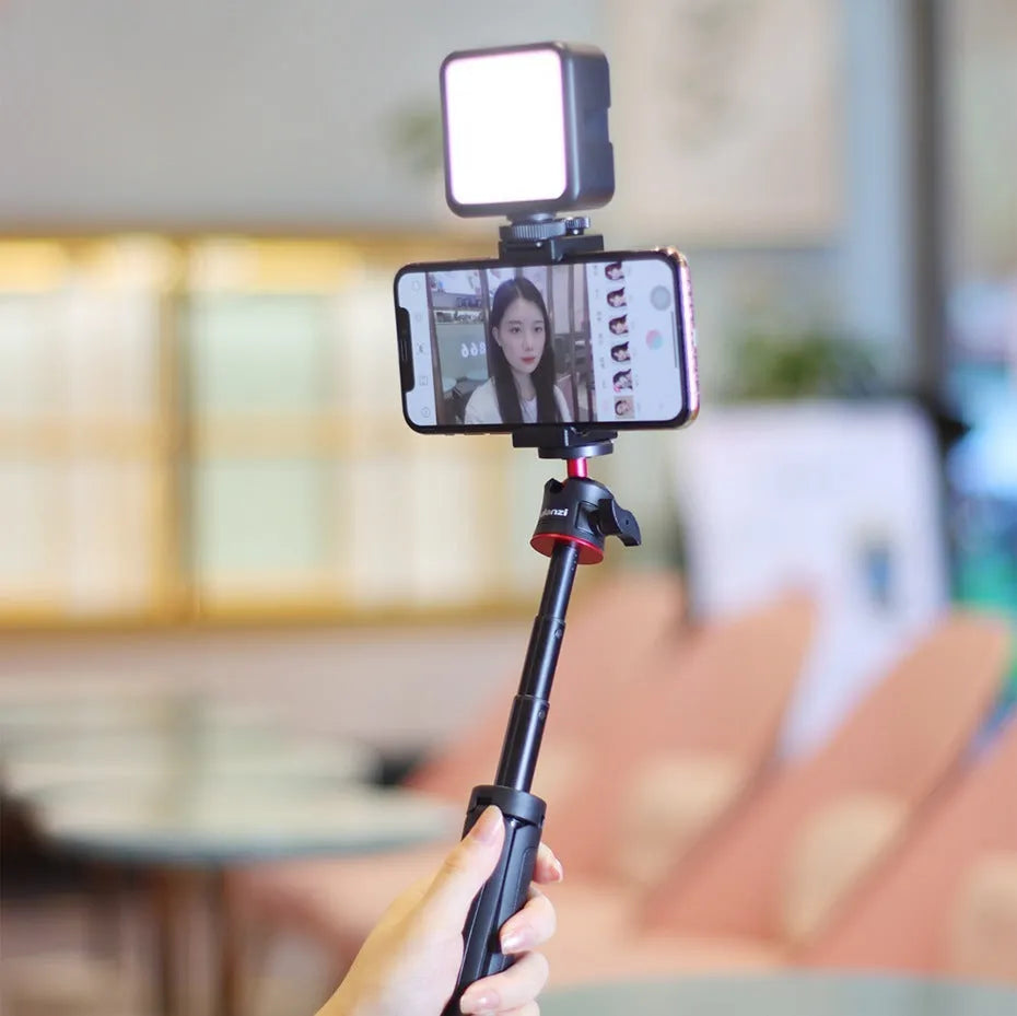 Mobile phone vlog bracket set with adjustable stand, fill light attachment, and selfie stick for video creation