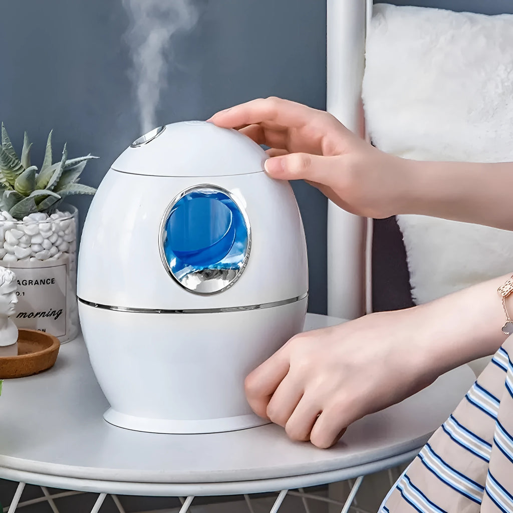 Small white aromatherapy humidifier with USB cable, water tank, and mist output