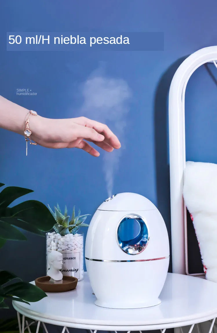 Small white aromatherapy humidifier with USB cable, water tank, and mist output