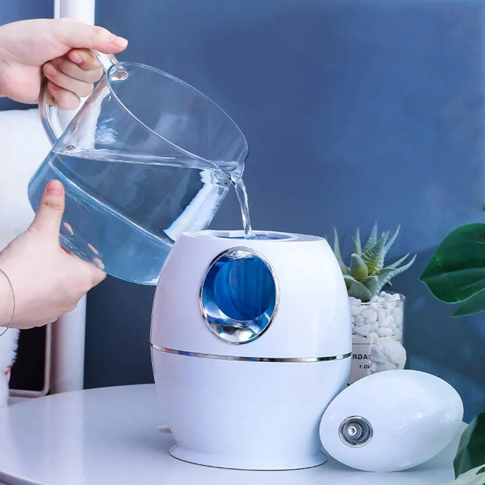 Small white aromatherapy humidifier with USB cable, water tank, and mist output