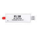Black all-band software defined radio receiver with gold SMA connector for aviation ADS-B and broadcast signals.