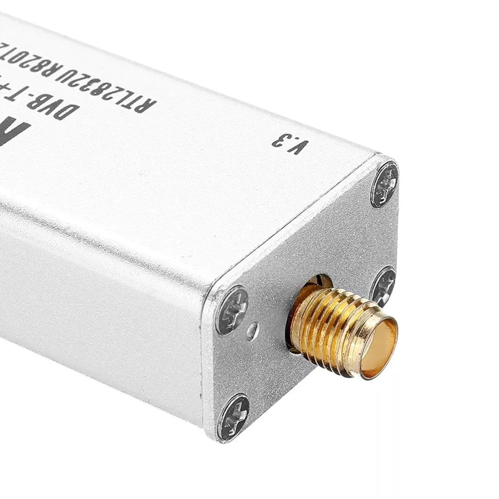 Black all-band software defined radio receiver with gold SMA connector for aviation ADS-B and broadcast signals.