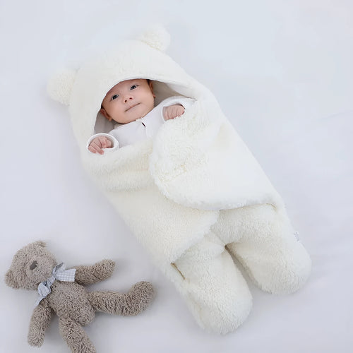 Baby quilted sleeping bag wrapper in cotton blend fabric showing colour options: white, red, grey, light blue, pink, khaki.