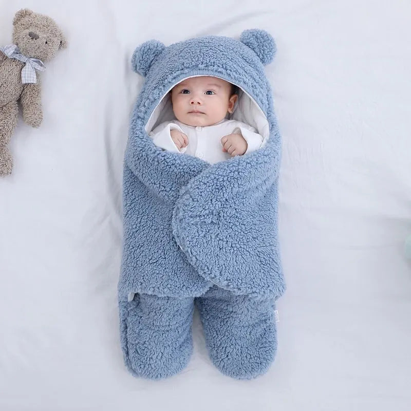 Baby quilted sleeping bag wrapper in cotton blend fabric showing colour options: white, red, grey, light blue, pink, khaki.
